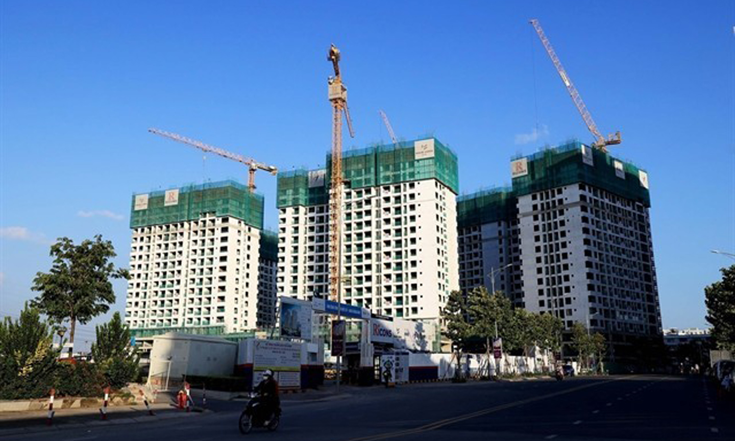 A housing project in HCM City. The State will regulate the market if property price rise by 20 per cent for three months. (Photo: VNA).