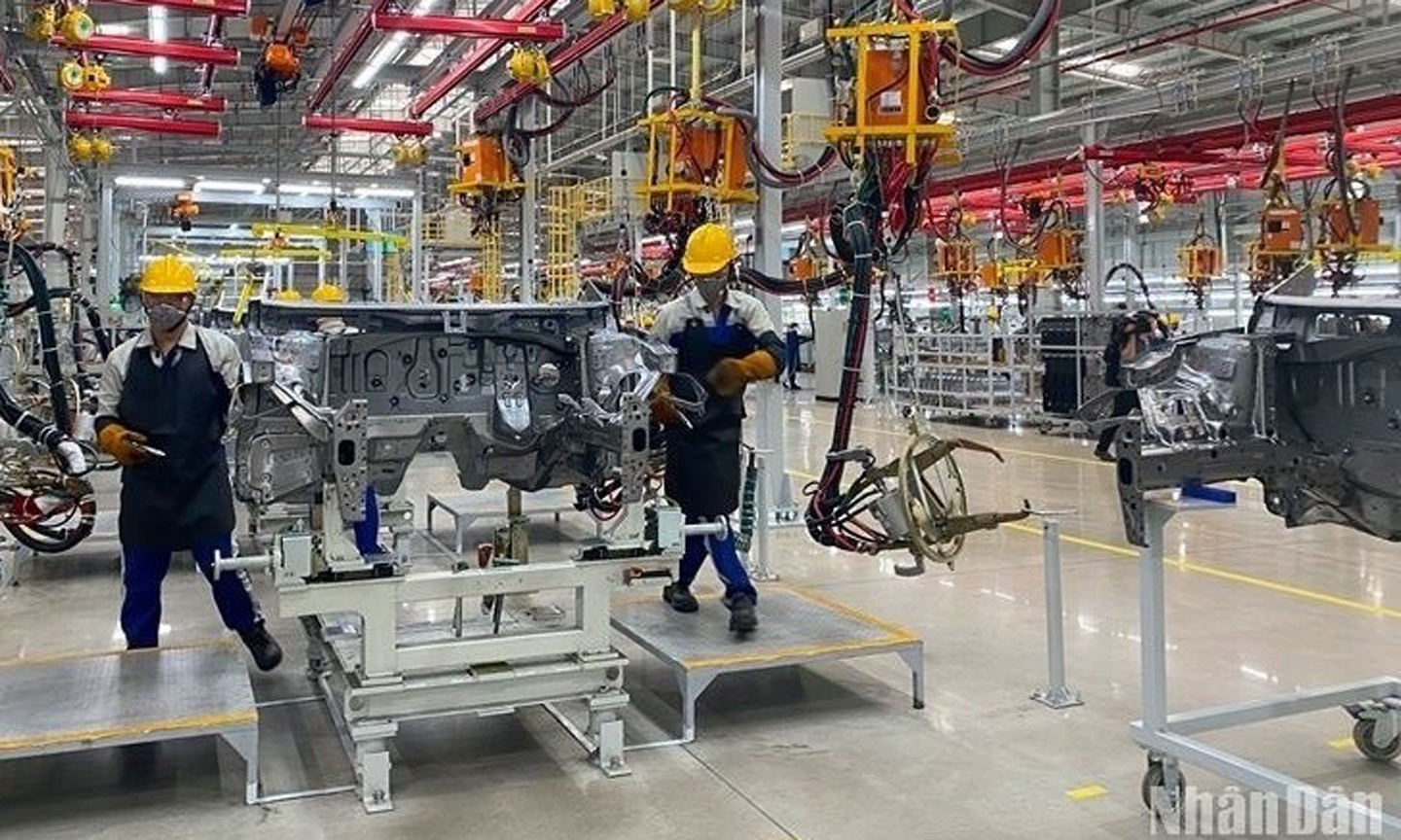 Workers assembling car parts at a plant of Hyundai Thanh Cong Automobile JSC.