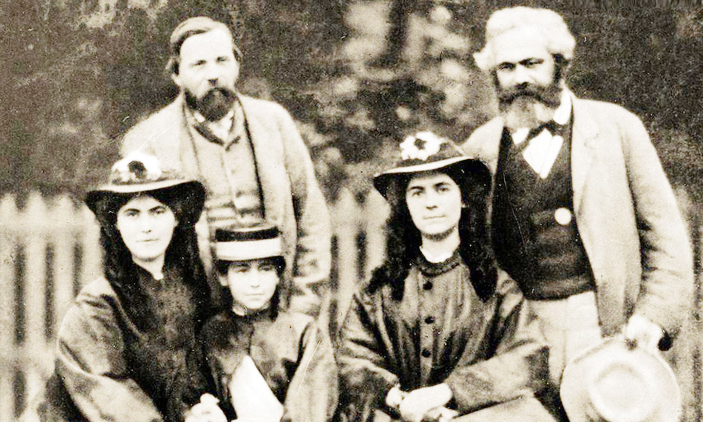 Ph.Ăngghen, C.Mác cùng các con gái của C.Mác năm 1864. 